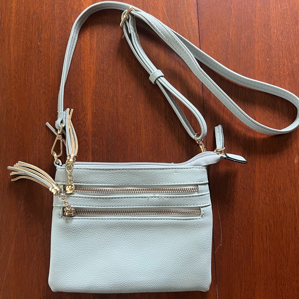 Elegant Sky Blue Crossbody Bag with Gold Details